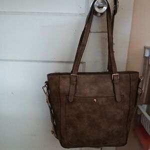 Stone Mountain Accessories Brown Tote Bag with crossbody straps.